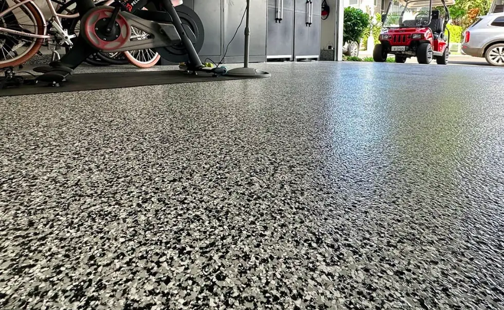 Close-up of a polyaspartic flake garage floor